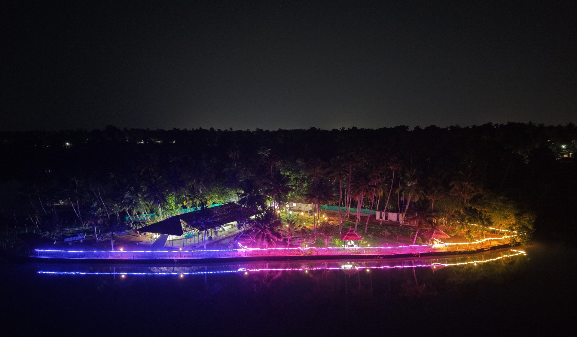 Night time Drone shot of Love Shore - Wedding and Events venue in the shore of backwaters of Kalakkode, Kerala.